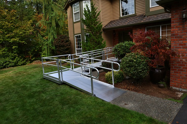 A modular wheelchair ramp installed in front of a residential home.