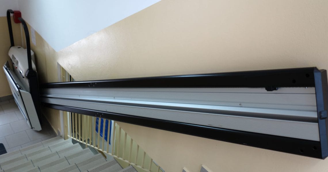 Stair platform lift installed on a staircase for accessibility.