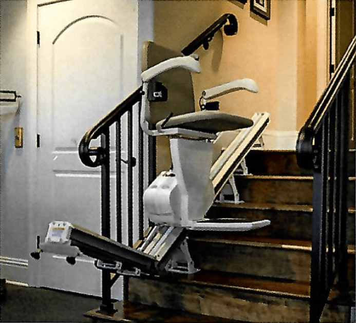 Stairlift installed on a residential staircase.