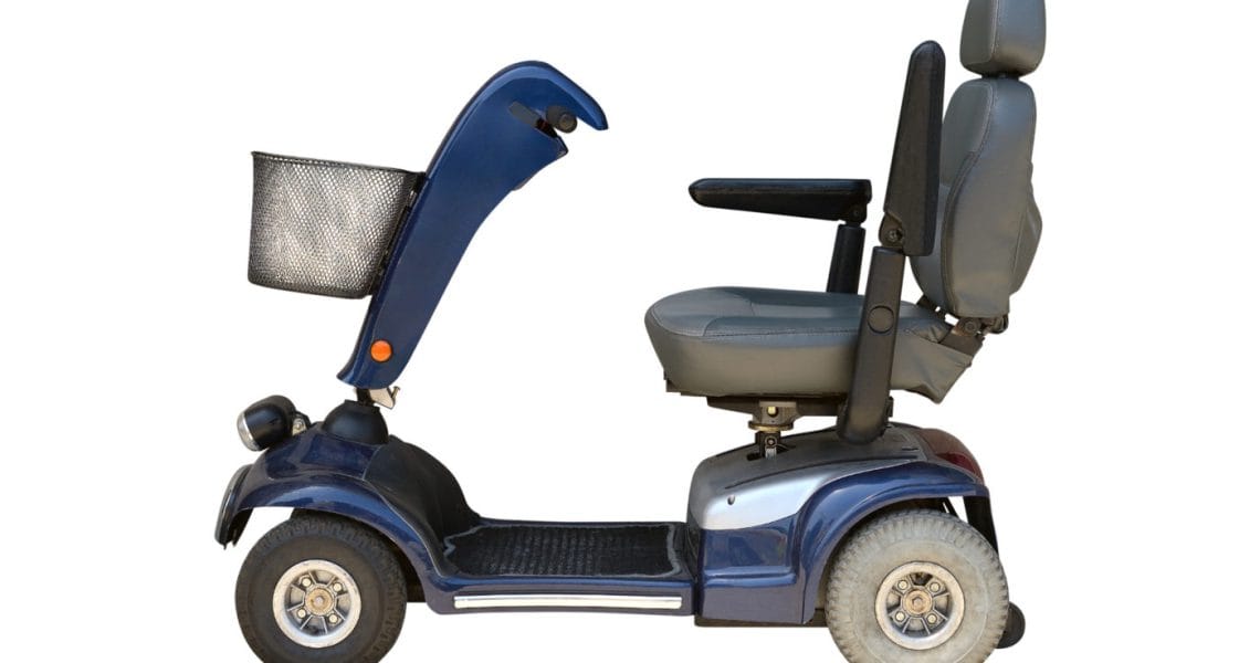 Blue mobility scooter isolated on a white background.